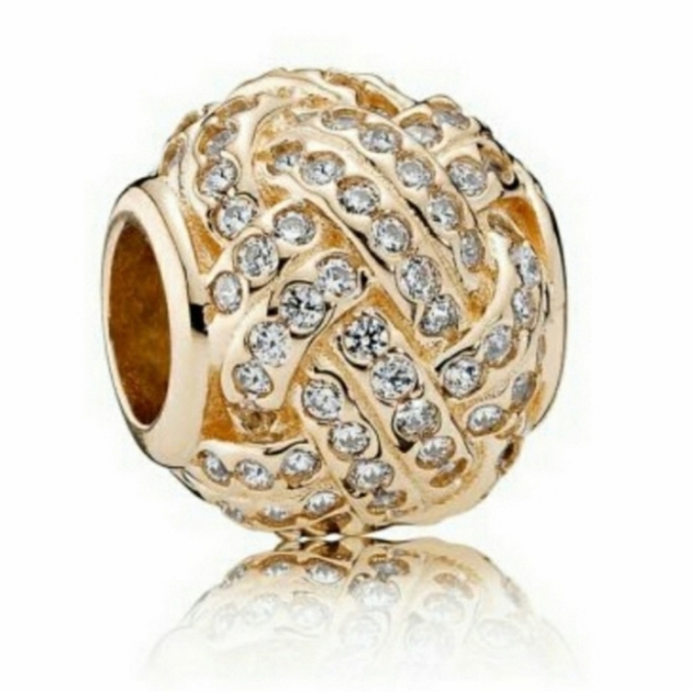 Pandora Retired  Love knot 14k yellow gold.